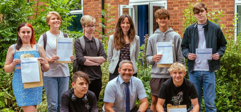 Students at SET Beccles on GCSE results day with (centre) Head of School Heidi Philpott.